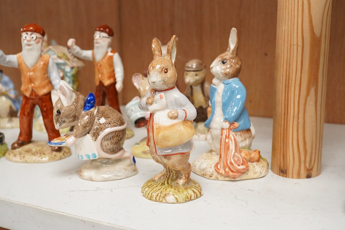 A collection of eighteen mixed Royal Doulton and Royal Albert figures of Beatrix Potter characters, largest 13cm high